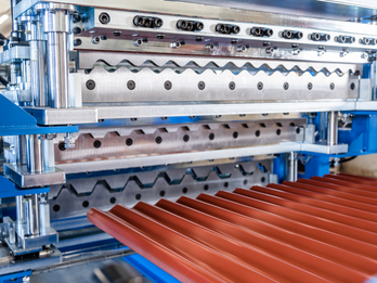 Triple deck rollformer for roofing and siding panels
