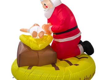 Santa prays to the Baby Jesus