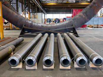 Clad pipe and large radius bends