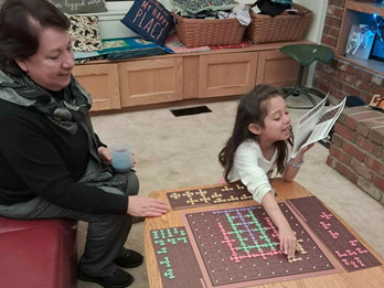 Fanily Game Night - AnaRosa & Grandmom build Rainbow Tree Puzzle