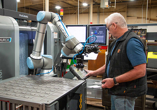 Cobot providers have had a hyper-focus on simplifying the cobot integration experience and improving the cobot operator experience, such as through the easy-to-use pendant on this system from Universal Robotics. This fabricator obtained 24 hours of lights-out operation for more than a 600% productivity boost in machining.